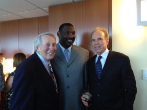 Three men in suits and ties posing for a picture.